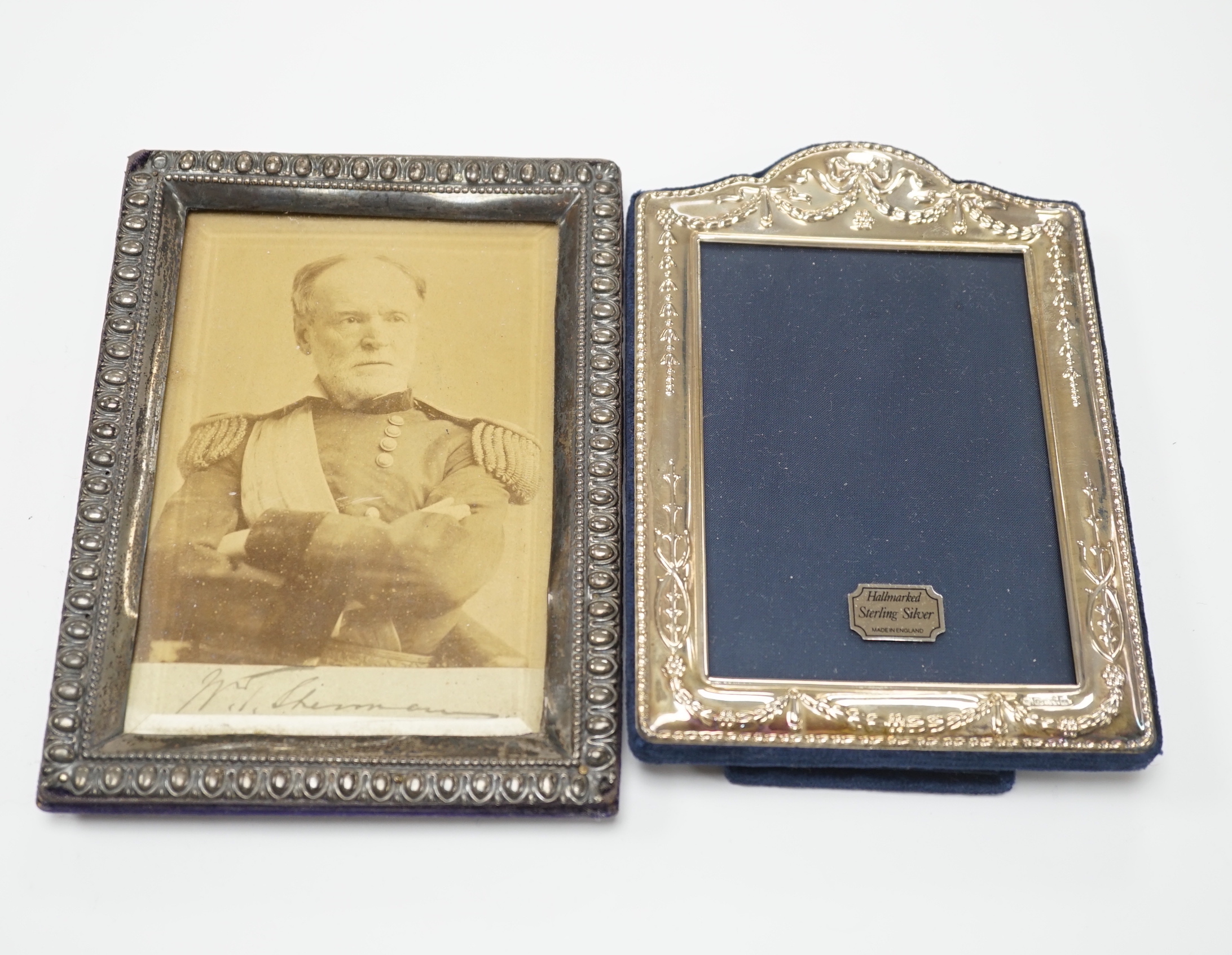 An Edwardian silver mounted photograph frame, Henry Matthews, Birmingham, 1904, 17.2cm and a modern silver mounted photograph frame.